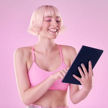 Tablet, fashion and woman with smile on pink background for social media, online website and internet. Communication mockup, beauty and girl with makeup, cosmetics and digital tech for chatting.