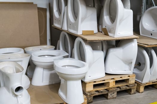 Lot of white toilets in a hardware store, plumbing department