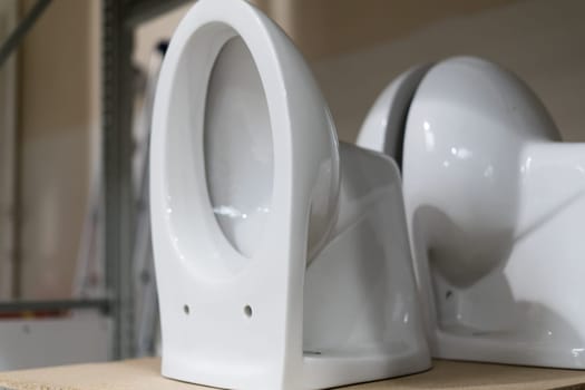 Lot of white toilets in a hardware store, plumbing department