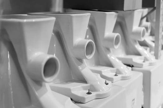 Lot of white toilets in a hardware store, plumbing department