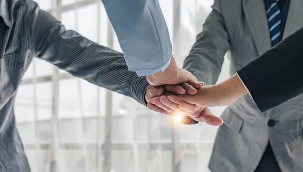 Business handshake for teamwork of business merger and acquisition,successful negotiate,hand shake,two businessman shake hand with partner to celebration partnership and business deal concept...