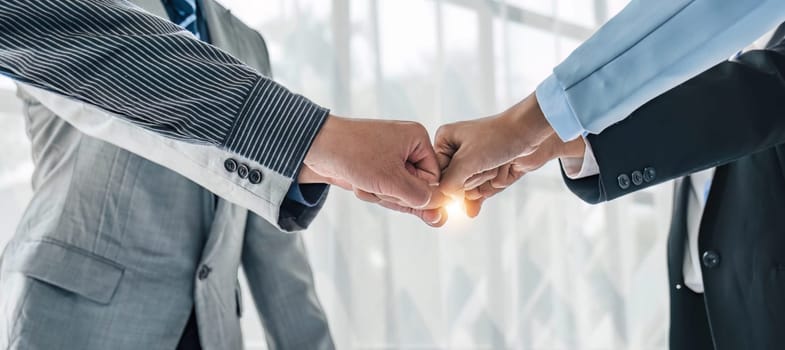 Business handshake for teamwork of business merger and acquisition,successful negotiate,hand shake,two businessman shake hand with partner to celebration partnership and business deal concept...