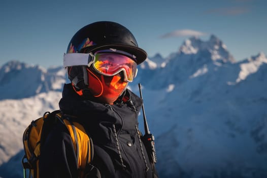 Skier smiling happy cheerful satisfied woman in warm windbreaker jacket ski goggles mask glasses spend extreme weekend in mountains on resort.