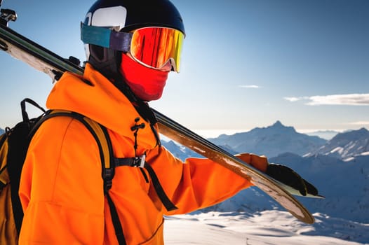 shot of a skier standing on top of a mountain with skis on his shoulder on a sunny winter day, sunlight, outdoor recreation, skiing, lifestyle, downhill sport concept.