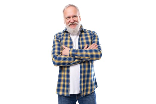 handsome senior pensioner gray-haired man with a beard in a shirt on a white background.