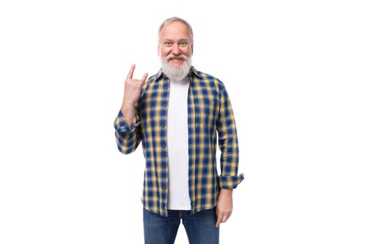 senor gray-haired retired man with a mustache and beard pointing to the side with his index finger.