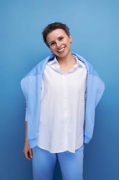 cheerful short-haired young woman in a casual shirt.