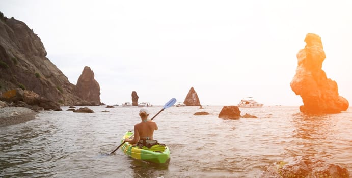 Kayaking. Travel adventure kayak on the tropical sea on a sunny day. Woman rowing a canoe.