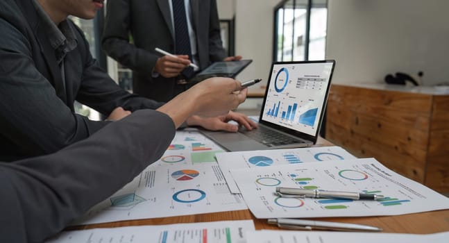 Close up of business people gather brainstorm discuss financial statistics at office meeting. finance, teamwork, Big data Graphs Charts concept.