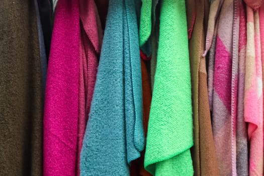 View on samples of cloth and fabrics in different colors found at a fabrics market.