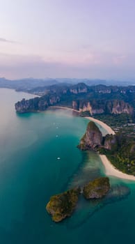 Railay Beach Krabi Thailand, the tropical beach of Railay Krabi, view from a drone of idyllic Railay Beach in Thailand in the evening at susnet with a cloudy sky