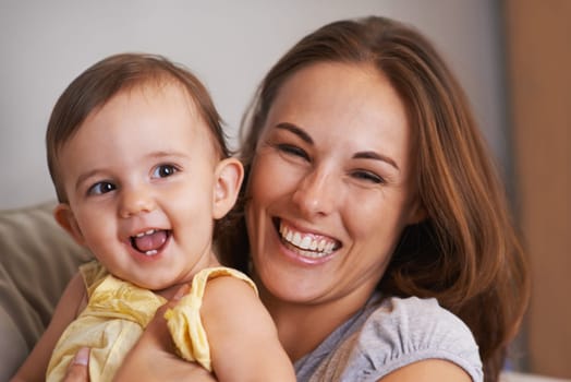 Loving bond. Closeup portrait of a mother and baby daughter laughing