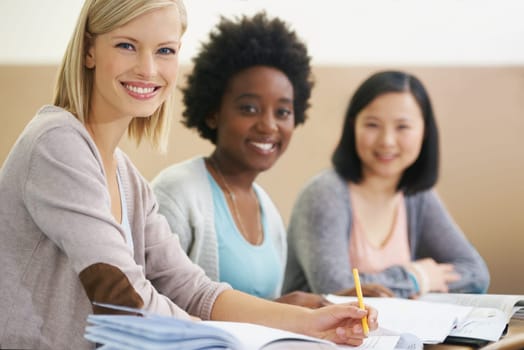 Her education is important to her. A group of students sitting in an exam room