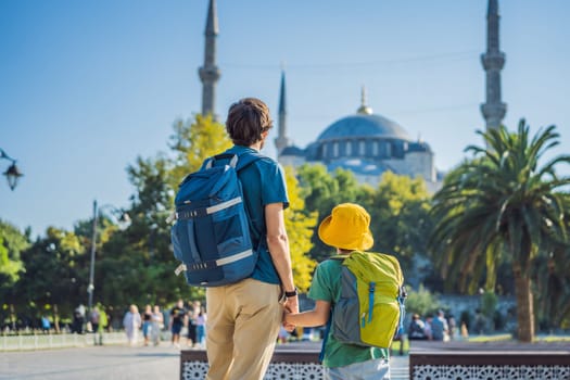 father and son tourists enjoying the view Blue Mosque Sultanahmet Camii Istanbul, Turkey. Traveling with kids concept.