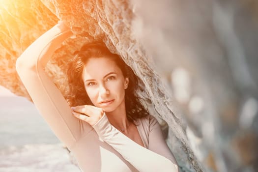 Happy young attractive brunette woman in red swimsuit, on the beach and sea background. Holiday vacation and travel concept.