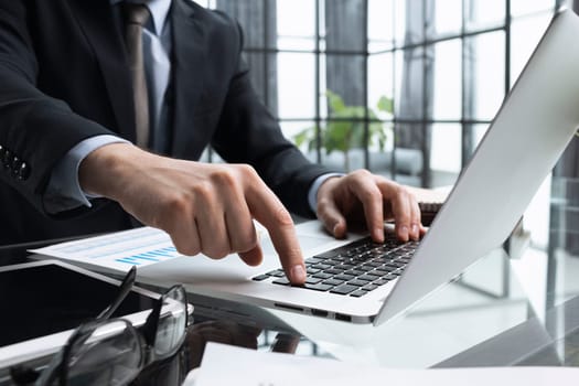 Close-up of male hands typing laptop keyboard. man using laptop