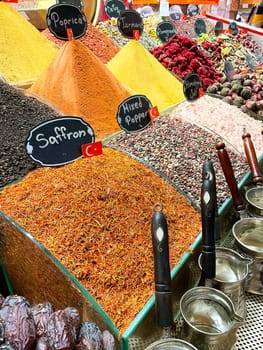 Spices Market with colourful mood. Multicolor spices sold at Egypt Bazaar (Misir Carsisi) in Istanbul, Turkey (Turkiye). Selected focus, copy space, colorful background