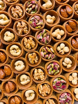 Oriental sweets close-up. Baklava with pistachios, walnuts, almonds. Photo for puzzles, postcards, articles, books.