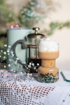 exotic latte with blue tapioca still life with beautiful flowers in the morning sun. High quality photo