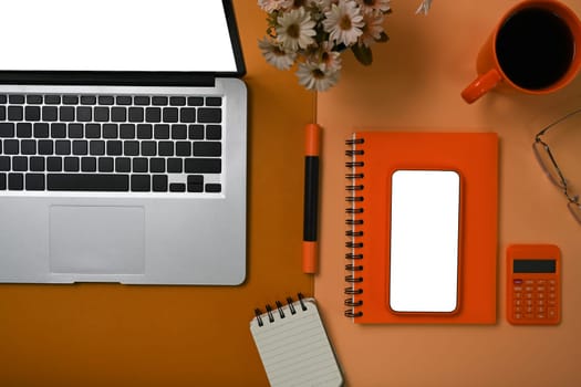 Mock up mobile phone, coffee cup, notebook and calculator on.accountant workspace.