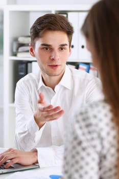 Male arm in white shirt offer contract form on clipboard pad and silver pen to sign closeup. Strike a bargain for profit white collar motivation union decision corporate sale insurance agent concept