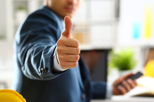 Male arm show OK or confirm during conference in office closeup. High level and quality product offer okay symbol expression perfect mediation solution happy client creative adviser participate