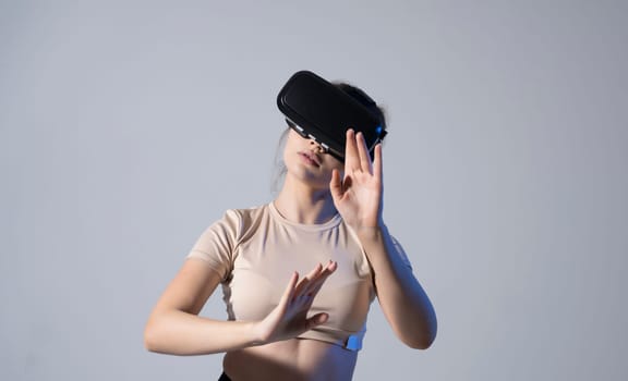 Female engineer wearing virtual reality headset designing a new pruducts or technologis using VR technology. Development and prototyping software