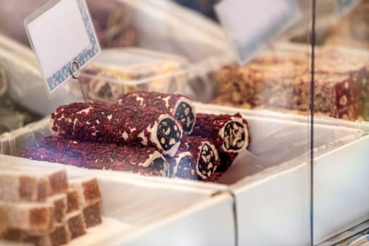 Turkish delight made from dried fruits and nuts at the bazaar. Turkish market with various national Turkish sweets. High quality photo