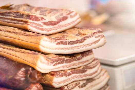 The ribs lie on the counter on top of each other. Meat factory. High quality photo