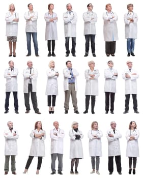 group of doctors standing in full length isolated on white background