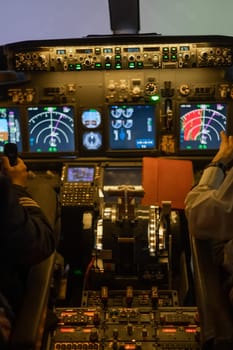 Close-up of the hands of the pilots on the controls of the aircraft