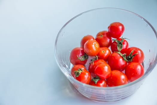 cherry tomatoes in transparent bowl