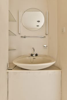 a bathroom with a sink and mirror on the wall next to it is an open door that has been painted white