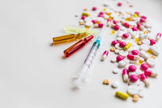 Medical colorful vials for injection syringe and red heart on a white background. Healthy heart.