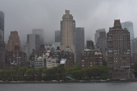 Gloomy Cloudy Rainy View of Manhattan from Roosevelt Island . High quality photo