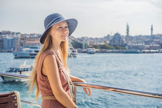 Happy woman enjoying the sea from ferry boat crossing Bosphorus in Istanbul. Summer trip to Istanbul.