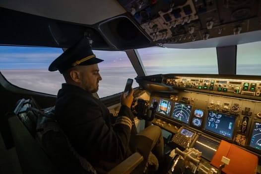 The pilot uses a smartphone while flying the plane. Autopilot