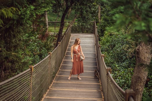Woman tourist in Rope bridge in Yildiz Park. Besiktas, Istanbul, Turkey. Turkiye.