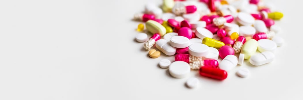 Frame of colorful antibiotic capsule pills. Pile of antibiotic capsule pills. Antibiotic drug resistance concept. Prescription drug.