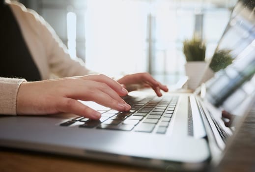 Businessman working at a home office uses a close-up keyboard,