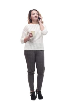 young woman with a smartphone and a takeaway coffee. isolated on a white background.