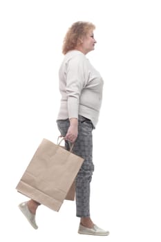full-length. casual adult woman with shopping bags. isolated on a white background.