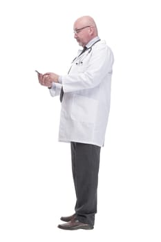 full-length. mature doctor with smartphone. isolated on a white background.