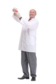 Mature scientist with grey hair and beard in white coat standing with beaker in his hand and holding medical test isolated on white background