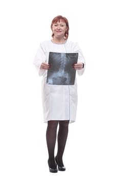 in full growth. competent woman with an x-ray . isolated on a white background.