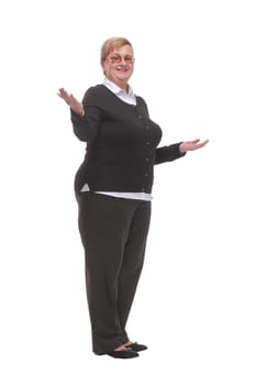 Mature woman shows her hands in different directions, standing on a white background. Successful senior woman. Teacher.