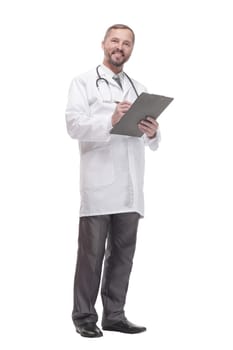 in full growth. smiling doctor with clipboard . isolated on a white background.