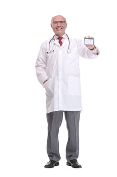 Portrait of confident mature doctor showing his business card and smiling while standing against white background