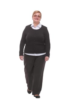Full length profile shot of an elderly woman walking isolated on white background