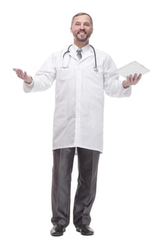 in full growth. smiling doctor with a digital tablet . isolated on a white background.